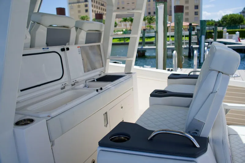 W7 Yacht Photos Pics 2022 Pursuit S 428 Sport boat interior with luxurious seating and amenities.