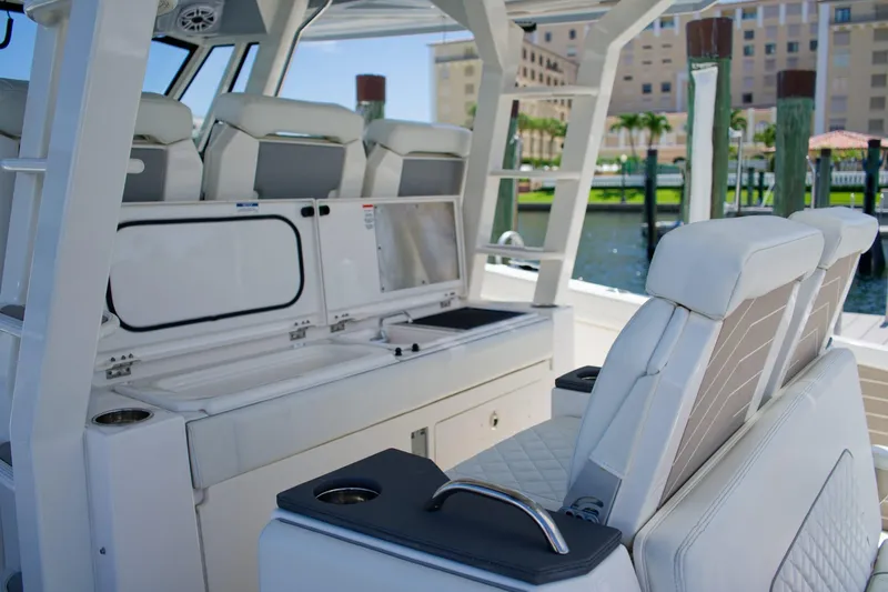W7 Yacht Photos Pics 2022 Pursuit S 428 Sport boat interior with luxurious seating and modern amenities.