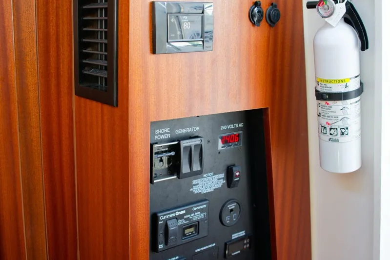 W7 Yacht Photos Pics Control panel and fire extinguisher on 2022 Pursuit S 428 Sport boat.