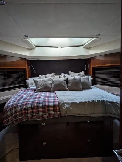  Yacht Photos Pics Luxurious bedroom interior of 2010 Princess 72 Motor Yacht with plush bedding and skylight.