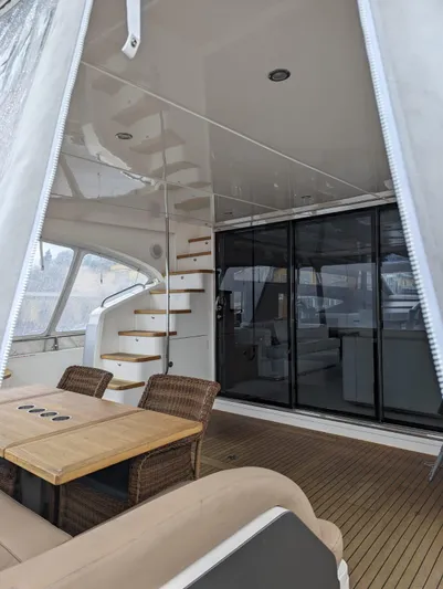  Yacht Photos Pics Luxurious 2010 Princess 72 Motor Yacht interior with elegant seating and spiral staircase.