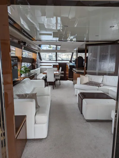  Yacht Photos Pics Luxurious interior of a 2010 Princess 72 Motor Yacht with elegant white seating.