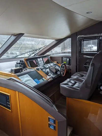  Yacht Photos Pics Helm of 2010 Princess 72 Motor Yacht with modern navigation equipment and leather seating.