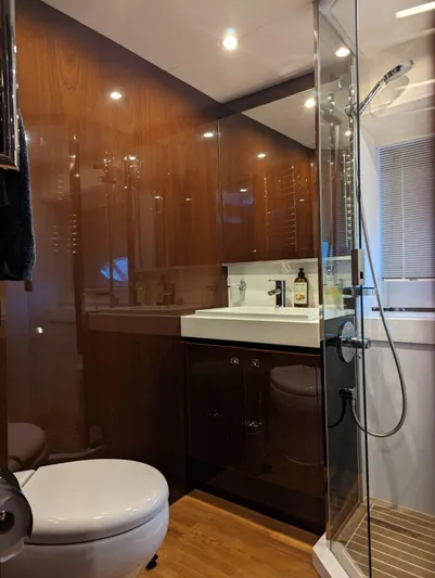  Yacht Photos Pics Luxurious bathroom in 2010 Princess 72 Motor Yacht with modern fixtures and wood accents.