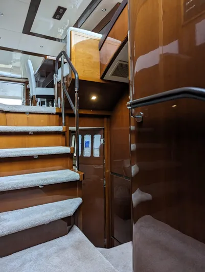  Yacht Photos Pics Interior of 2010 Princess 72 Motor Yacht with wooden stairs and modern design.