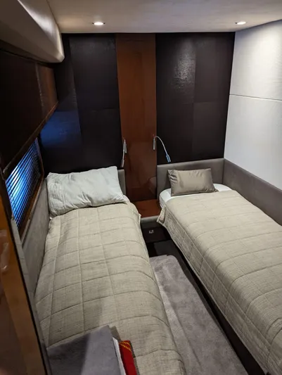  Yacht Photos Pics Twin beds in a 2010 Princess 72 Motor Yacht cabin, featuring modern decor and ambient lighting.