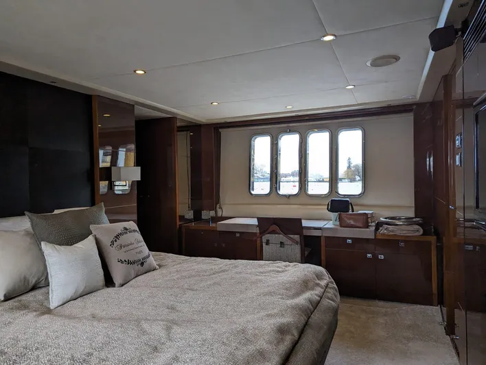  Yacht Photos Pics Luxurious bedroom interior of 2010 Princess 72 Motor Yacht with elegant furnishings.
