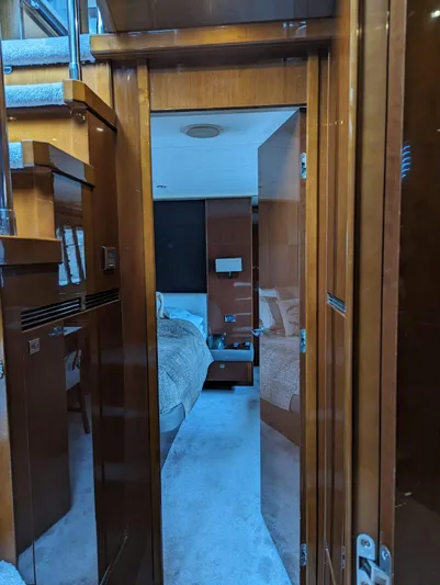  Yacht Photos Pics Interior view of a 2010 Princess 72 Motor Yacht cabin with wooden finishes.