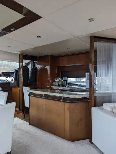  Yacht Photos Pics Luxurious interior of 2010 Princess 72 Motor Yacht with modern kitchen and seating area.