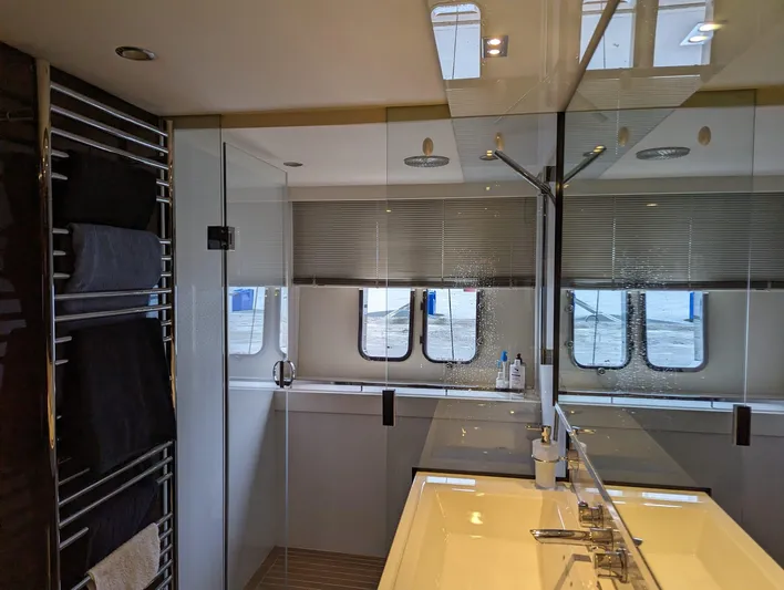  Yacht Photos Pics Luxurious bathroom interior of 2010 Princess 72 Motor Yacht with modern fixtures and large mirror.