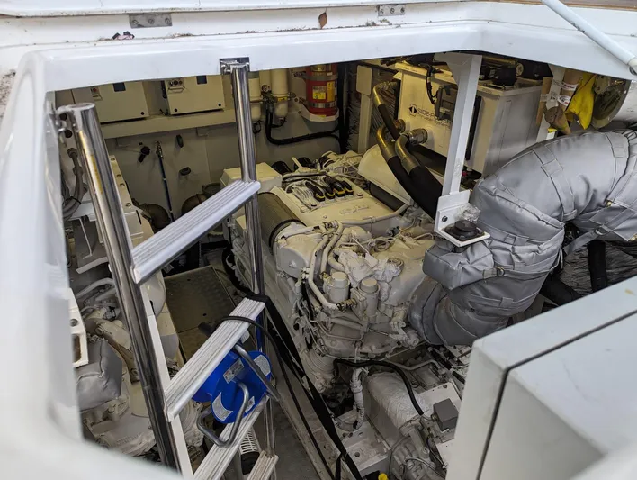  Yacht Photos Pics Engine room of a 2010 Princess 72 Motor Yacht, featuring machinery and equipment.