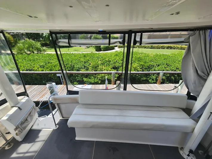  Yacht Photos Pics Silverton 442 Cockpit Motor Yacht 2000, interior view with seating and scenic greenery.