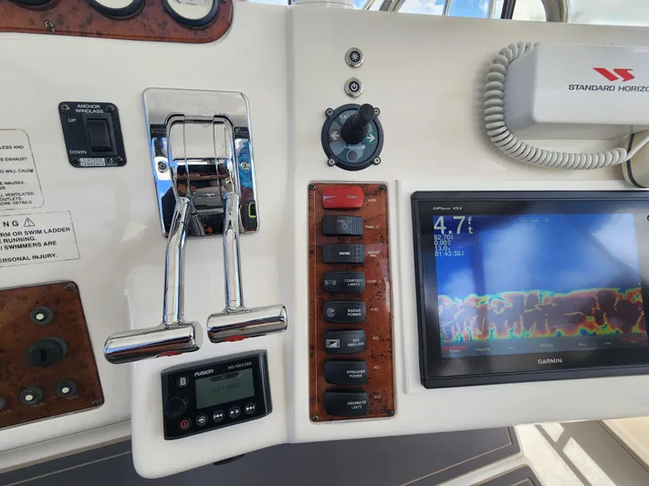  Yacht Photos Pics Control panel of 2000 Silverton 442 Cockpit Motor Yacht with navigation and throttle controls.