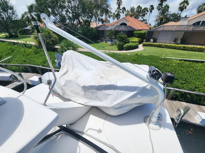  Yacht Photos Pics 2000 Silverton 442 Cockpit Motor Yacht with covered equipment on deck.