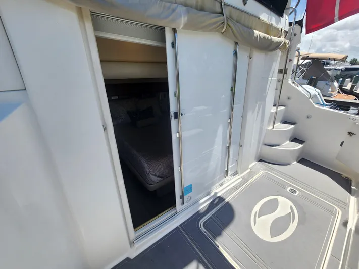  Yacht Photos Pics 2000 Silverton 442 Cockpit Motor Yacht interior view with open sliding door and stairs.