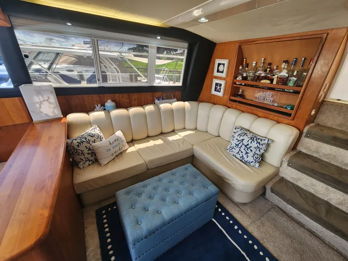  Yacht Photos Pics Luxurious interior of 2000 Silverton 442 Cockpit Motor Yacht with plush seating and bar.