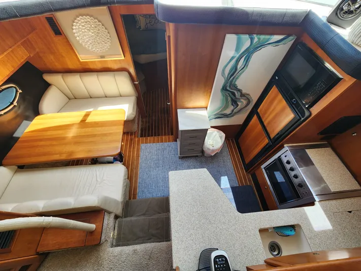  Yacht Photos Pics Interior of 2000 Silverton 442 Cockpit Motor Yacht with modern kitchen and dining area.