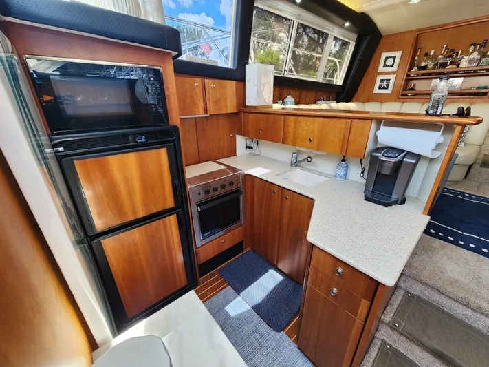  Yacht Photos Pics Interior of 2000 Silverton 442 Cockpit Motor Yacht with modern kitchen amenities.