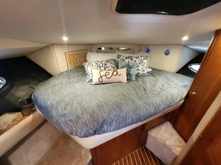  Yacht Photos Pics Cozy bedroom in 2000 Silverton 442 Cockpit Motor Yacht with nautical decor.