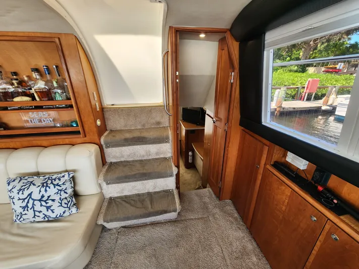  Yacht Photos Pics Interior of 2000 Silverton 442 Cockpit Motor Yacht with cozy seating and wooden cabinetry.