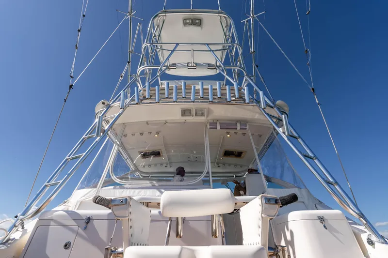  Yacht Photos Pics 2005 Cabo 40 Express yacht with tower against clear blue sky.