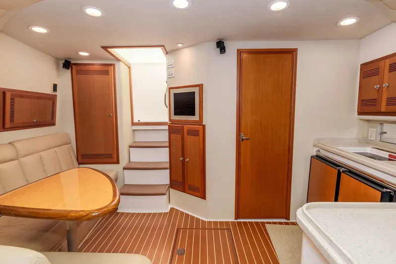  Yacht Photos Pics Luxurious 2005 Cabo 40 Express yacht interior with wood accents and modern amenities.