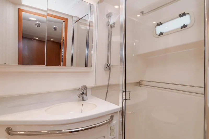  Yacht Photos Pics Luxurious bathroom in 2005 Cabo 40 Express yacht with modern fixtures and shower.