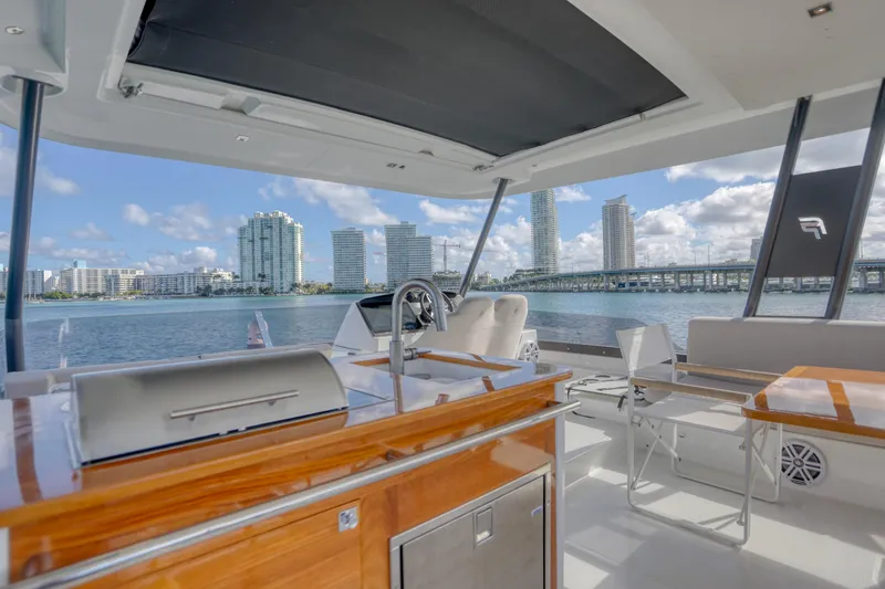 Hawkeye Yacht Photos Pics 2022 Fountaine Pajot MY6 yacht with modern deck and city skyline view.