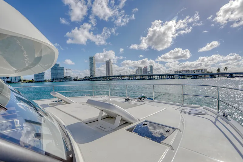 Hawkeye Yacht Photos Pics 2022 Fountaine Pajot MY6 yacht on water with city skyline and bridge in background.