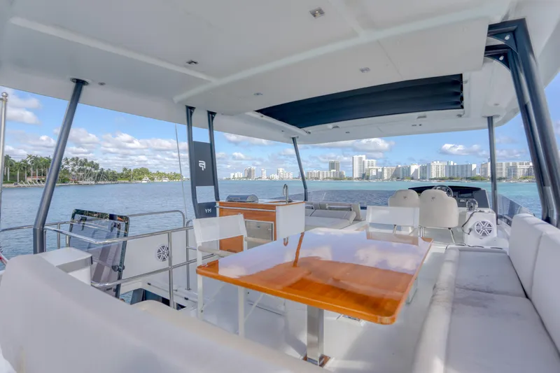 Hawkeye Yacht Photos Pics Luxurious 2022 Fountaine Pajot MY6 yacht with spacious deck and waterfront view.