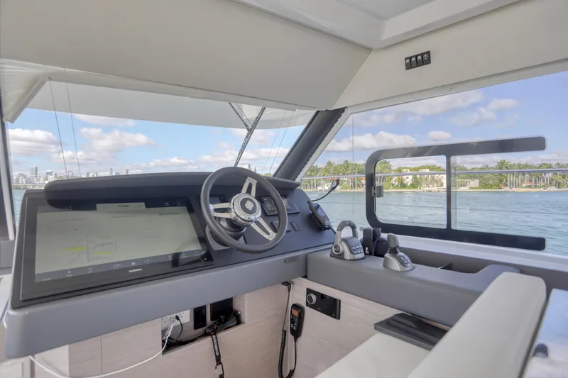 Hawkeye Yacht Photos Pics Cockpit of 2022 Fountaine Pajot MY6 yacht with modern steering and navigation system.