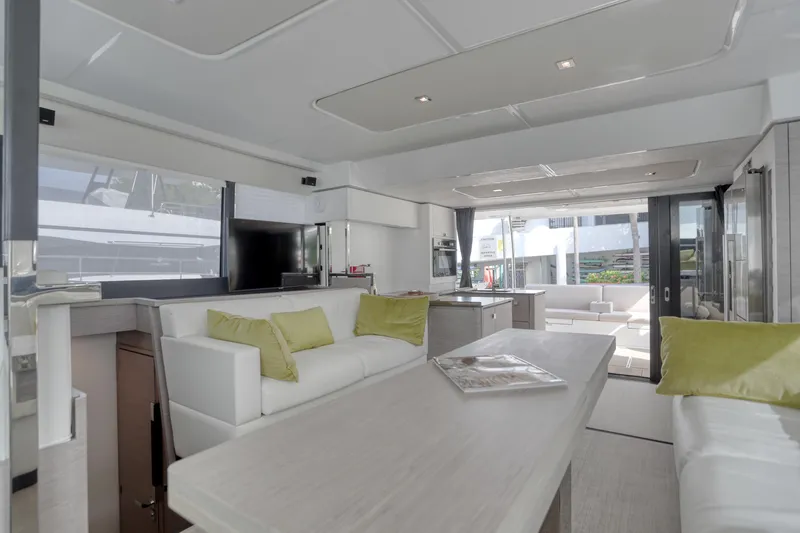 Hawkeye Yacht Photos Pics Luxurious interior of 2022 Fountaine Pajot MY6 yacht with modern furnishings and ample natural light.
