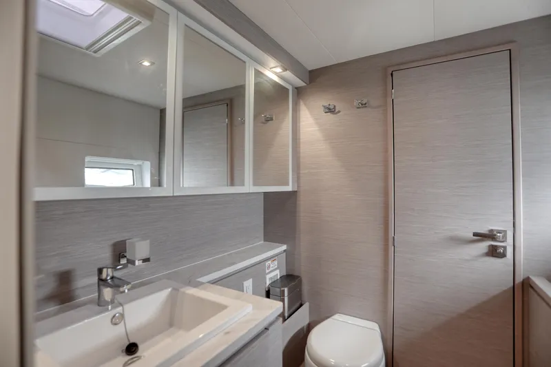 Hawkeye Yacht Photos Pics Modern bathroom interior on 2022 Fountaine Pajot MY6 yacht, featuring sleek design and fixtures.