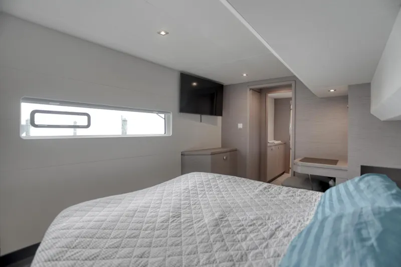 Hawkeye Yacht Photos Pics Modern bedroom interior on 2022 Fountaine Pajot MY6 yacht, featuring sleek design and natural light.