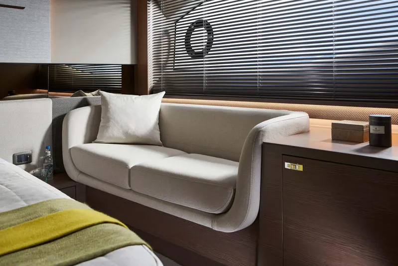  Yacht Photos Pics Luxurious interior of 2025 Princess V55 Express yacht with elegant sofa and modern decor.