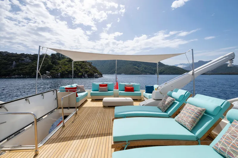 Astarte Yacht Photos Pics Luxurious 2007 Ferretti Yachts 830 with sun deck, turquoise loungers, and scenic ocean view.