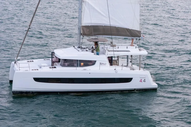 Point Clear Yacht Photos Pics 2023 Bali 4.4 catamaran sailing on open water, showcasing sleek design and spacious deck.
