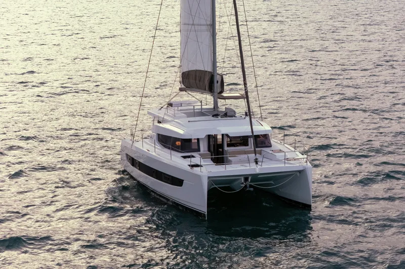 Point Clear Yacht Photos Pics 2023 Bali 4.4 catamaran sailing on open sea, showcasing modern design and spacious deck.