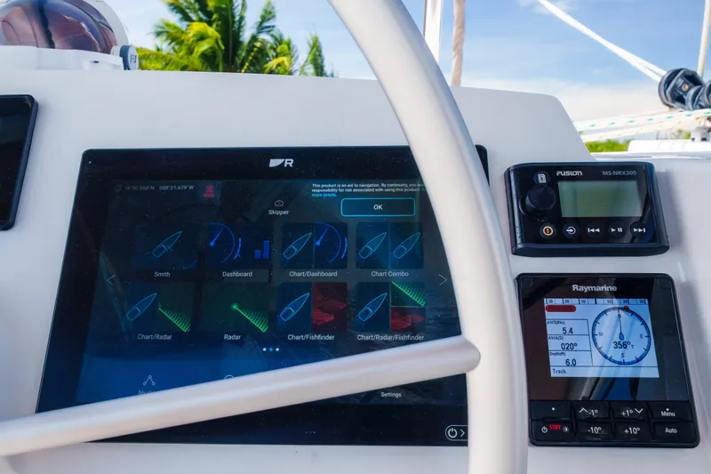 Point Clear Yacht Photos Pics Boat dashboard with navigation screens and controls, Bali 4.4, 2023 model.