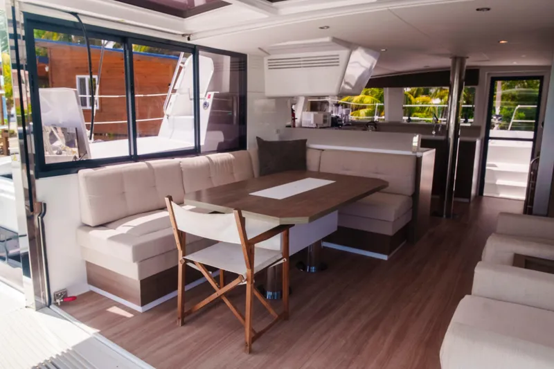 Point Clear Yacht Photos Pics Modern interior of 2023 Bali 4.4 yacht with spacious seating and dining area.