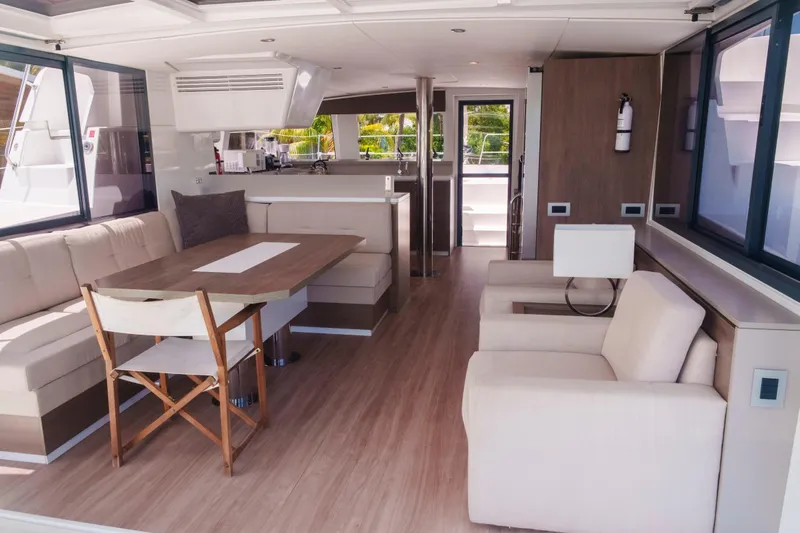Point Clear Yacht Photos Pics Luxurious interior of 2023 Bali 4.4 yacht with modern seating and dining area.