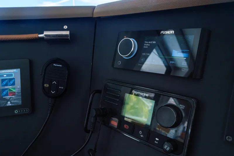 Point Clear Yacht Photos Pics Control panel of a 2023 Bali 4.4 yacht with navigation and audio systems.