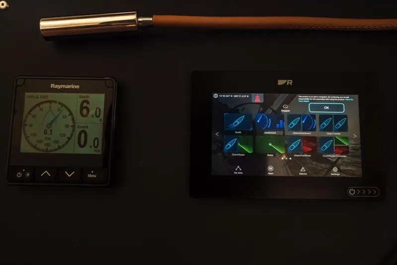 Point Clear Yacht Photos Pics Control panel of 2023 Bali 4.4 yacht with Raymarine display and navigation screen.