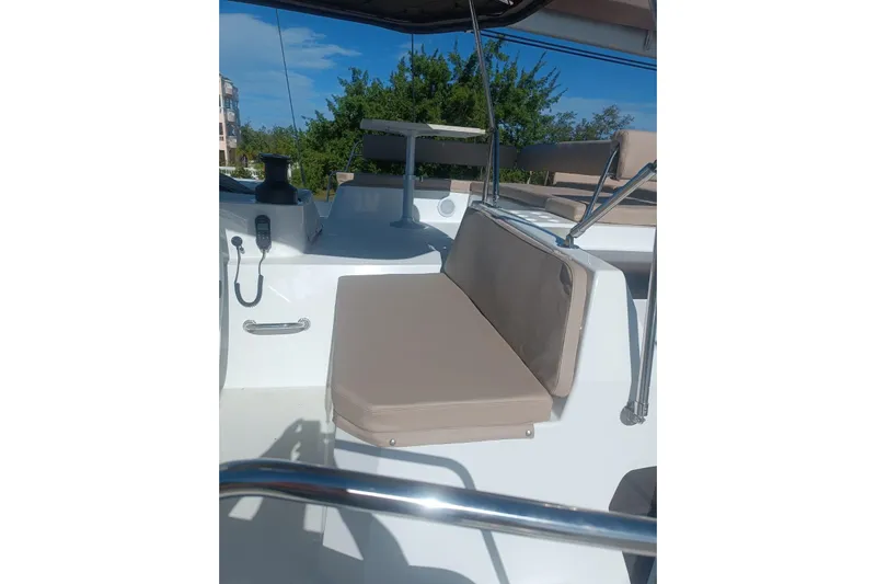 Point Clear Yacht Photos Pics 2023 Bali 4.4 yacht deck with beige seating and modern fixtures.