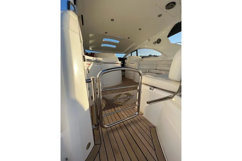  Yacht Photos Pics Interior view of 2006 Sunseeker Portofino 47 yacht with sleek seating and wooden flooring.