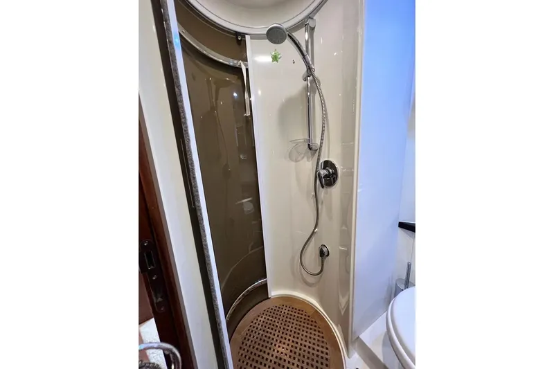  Yacht Photos Pics Shower area in 2006 Sunseeker Portofino 47 yacht, featuring modern fixtures.