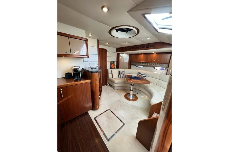  Yacht Photos Pics Luxurious interior of 2006 Sunseeker Portofino 47 yacht with elegant seating and wood finishes.