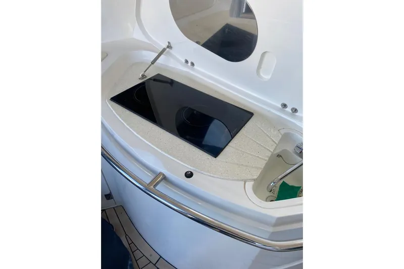  Yacht Photos Pics 2006 Sunseeker Portofino 47 yacht kitchen with sleek stovetop and sink.