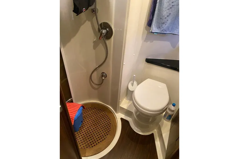  Yacht Photos Pics Bathroom interior of 2006 Sunseeker Portofino 47 yacht, featuring shower and toilet.