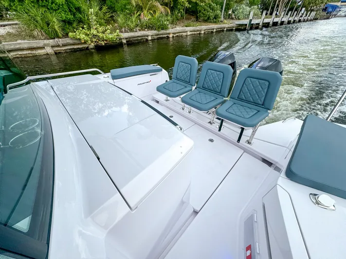  Yacht Photos Pics 2024 Axopar 37XC CROSS CABIN boat with sleek design and comfortable seating.